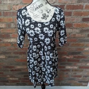 Black baby doll style dress with daisies.